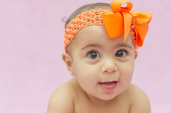 cute-baby-with-orange-headwear