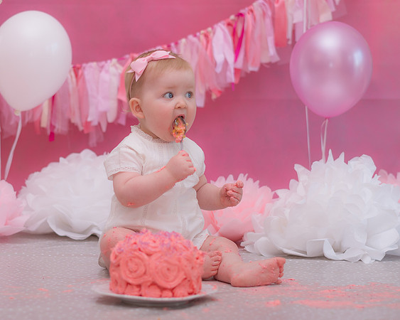 baby-girl-eating-her-birthday-cake