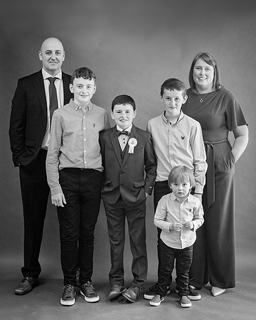 communion-boy-with-family