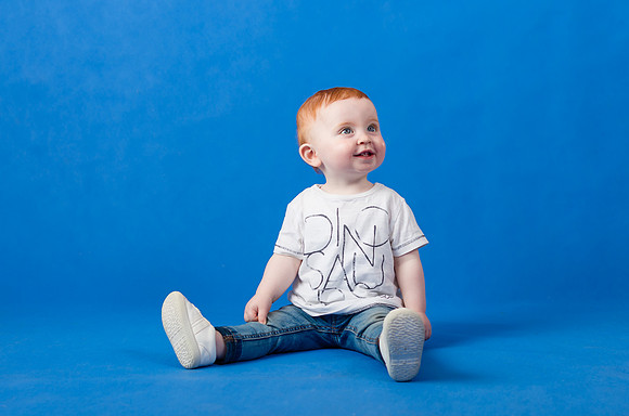 cute-baby-with-blue-background