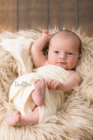 cute-baby-is-playing-with-his-feet