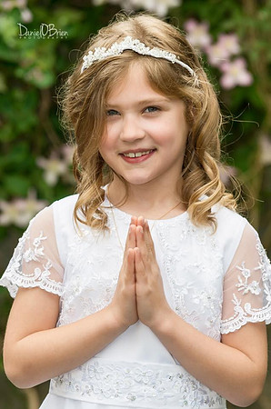 Girl-smiling-with-hands-together