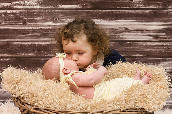 Little-girl-kiss-her-baby-sister