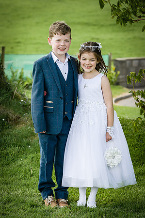 Communion-girl-with-her-brother-in-the-garden