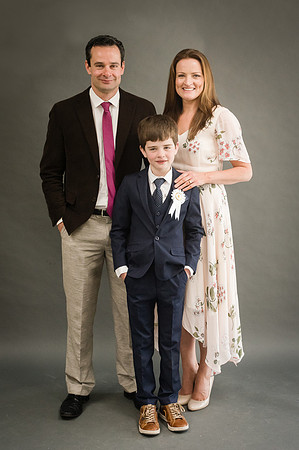 Communion-boy-with-his-parents