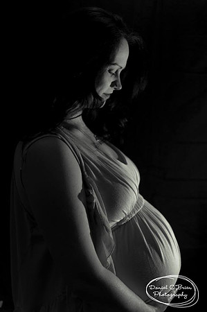 Pregnant women admire her belly