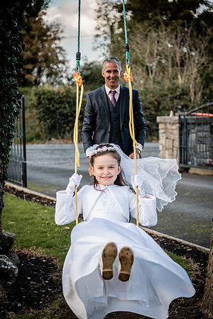 dad-pushing-daughter-on-the-swings