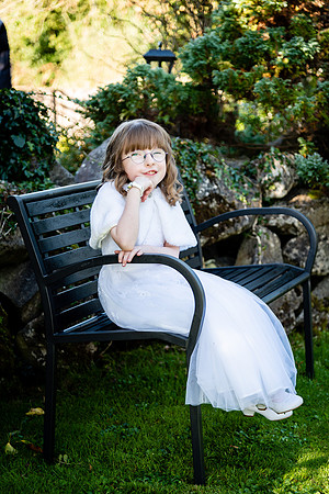 communion-girl-sitting-on-a-bench