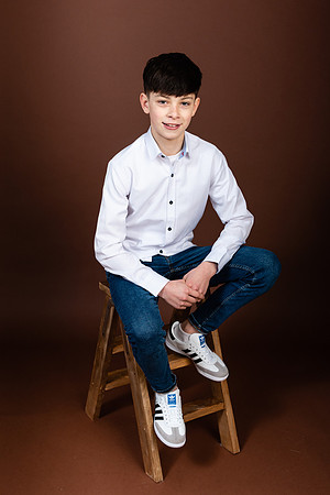 confirmation-boy-with-brown-background