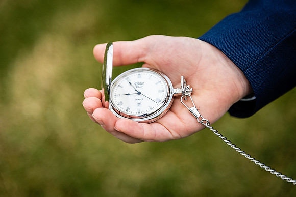 confirmation-boy-looking-at-his-watch