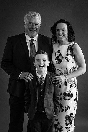 communion-boy-smiling-with-his-family