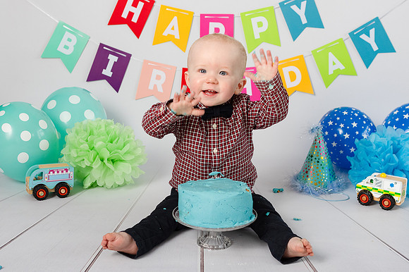 happy-baby-with-his-birthday-cake