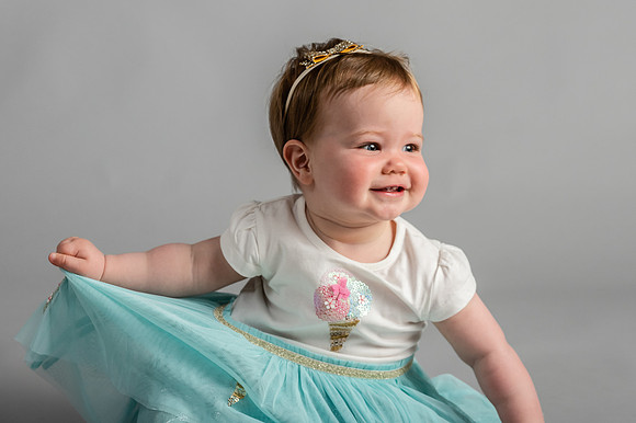 Baby-smiling-and-take-her-dress