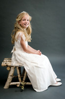 Girl-with-white-dress-sit-on-the-wood-chair