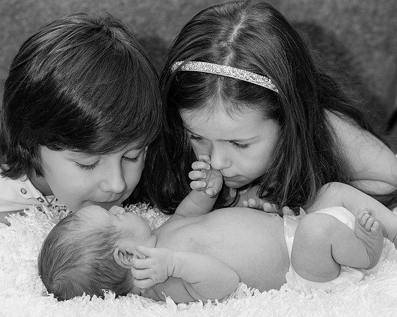 Children's-watch-their-little-baby-on-the-blanket