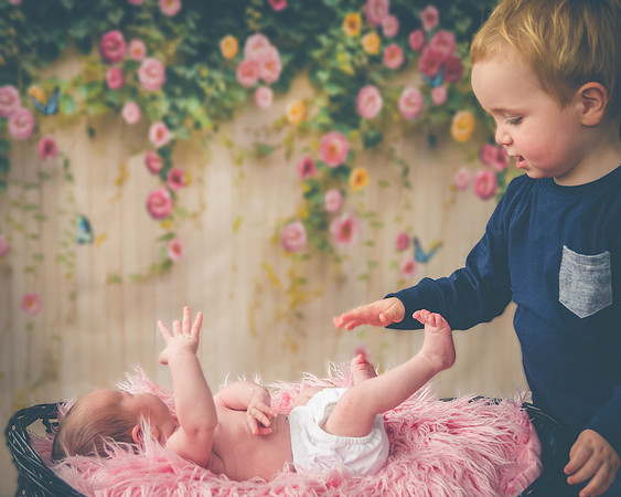 Little-boy-play-with-his-little-sister